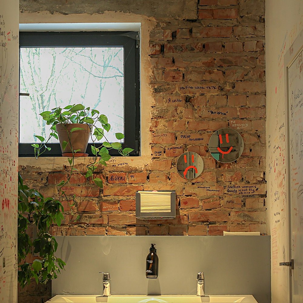 Industrial style bathroom designed by Next Level Design