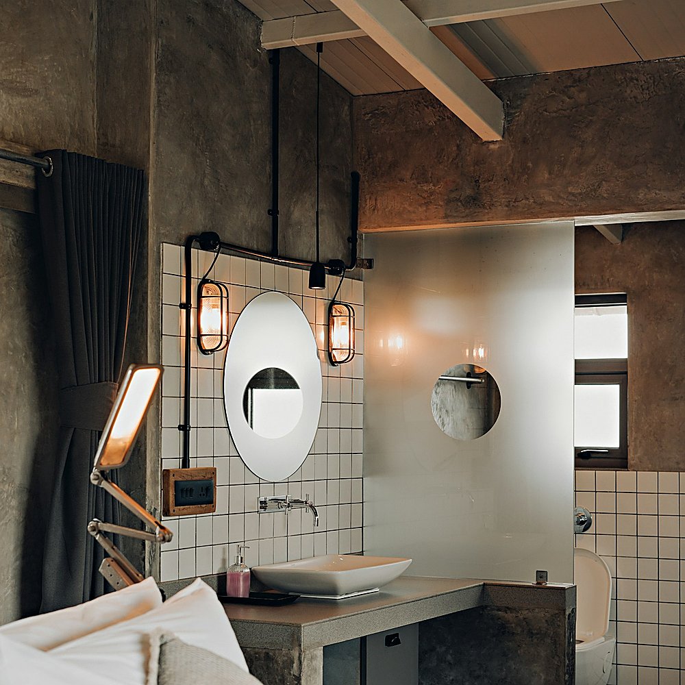 Industrial style bathroom designed by Next Level Design